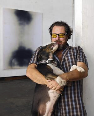 Julian Schnabel, with Tina, in his studio in Brooklyn.