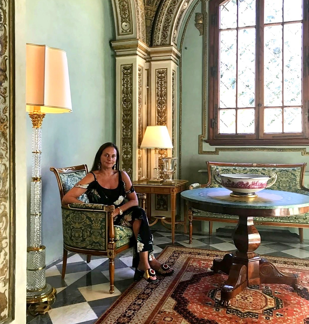 Joelle Maslaton Oster in a frescoed palazzo salon
